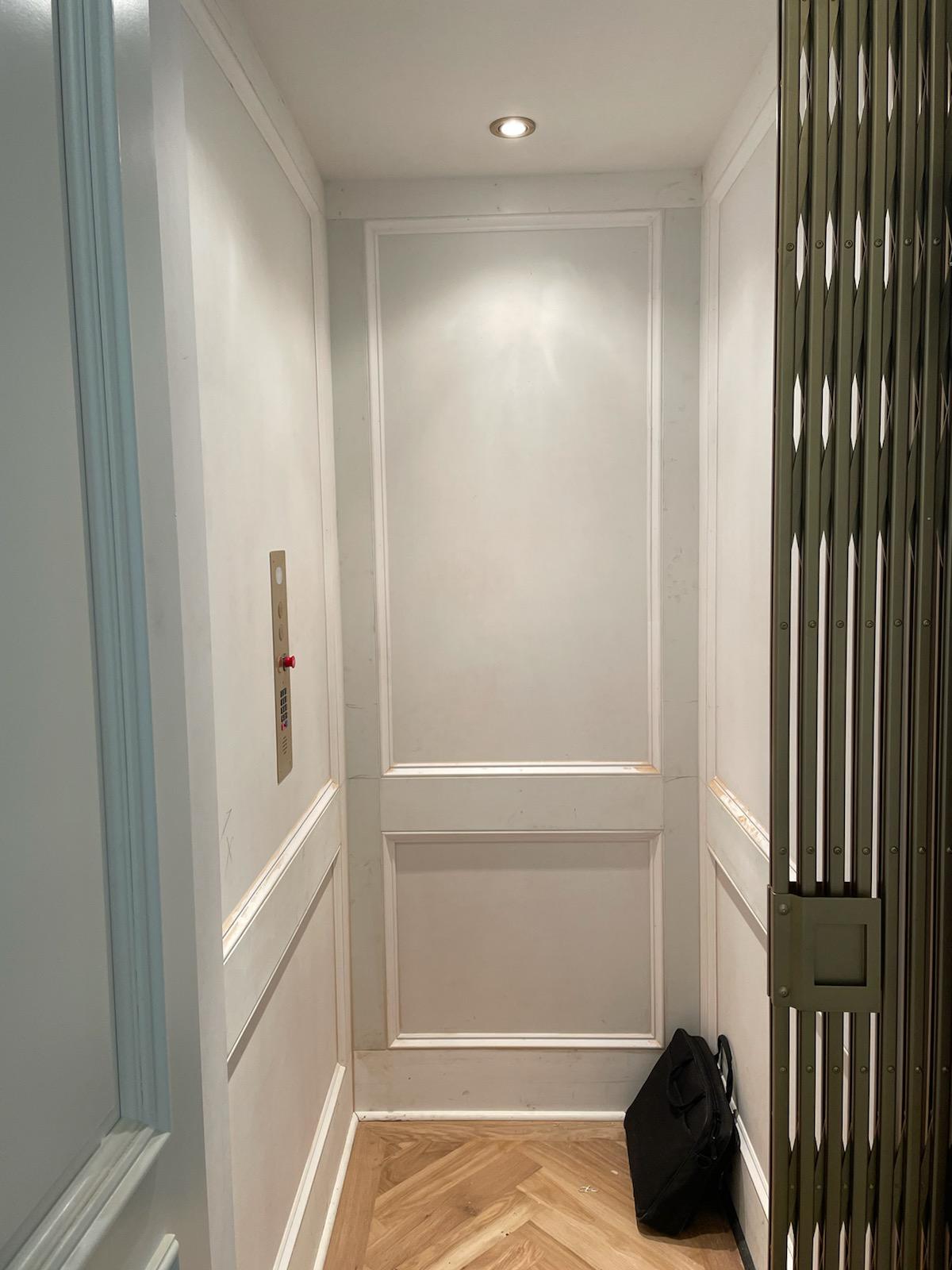 Professional Worker Checking on Elevator System