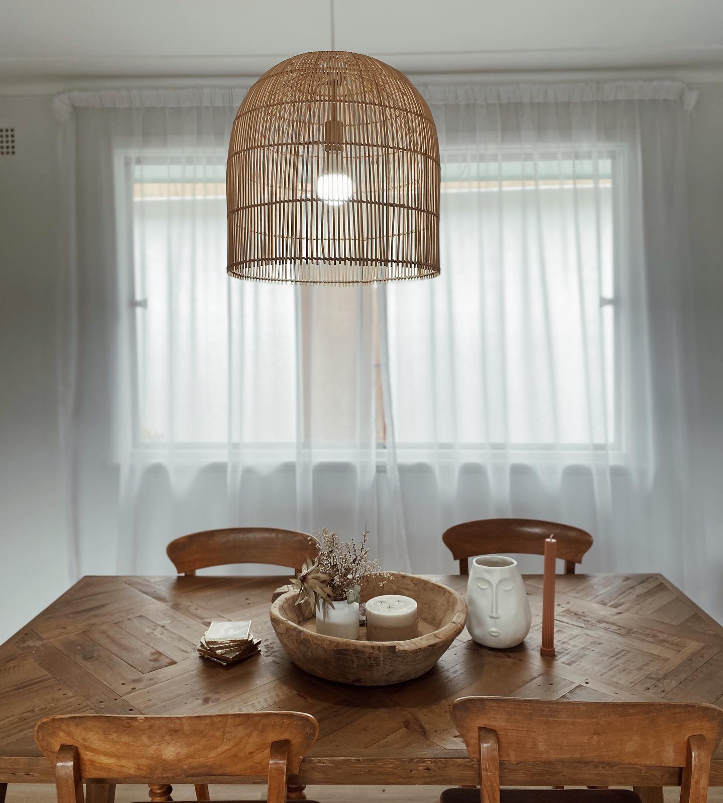 Rattan Pendant Light Above The Dining Table — Electrical Contractors in Walcha, NSW