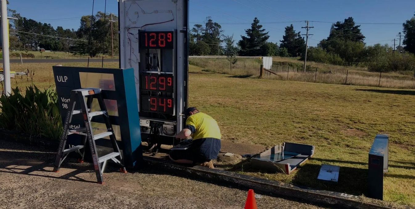 Electrician Fixing Digital Signage — Electrical Contractors in Armidale, NSW