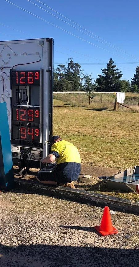 Electrician Working On A Digital Signage — Electrical Contractors in Inverell, NSW