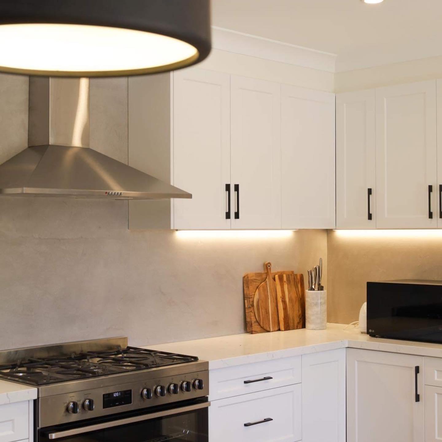 Electrician Installing Dimmer And A Light Switch — Electrical Contractors in Armidale, NSW