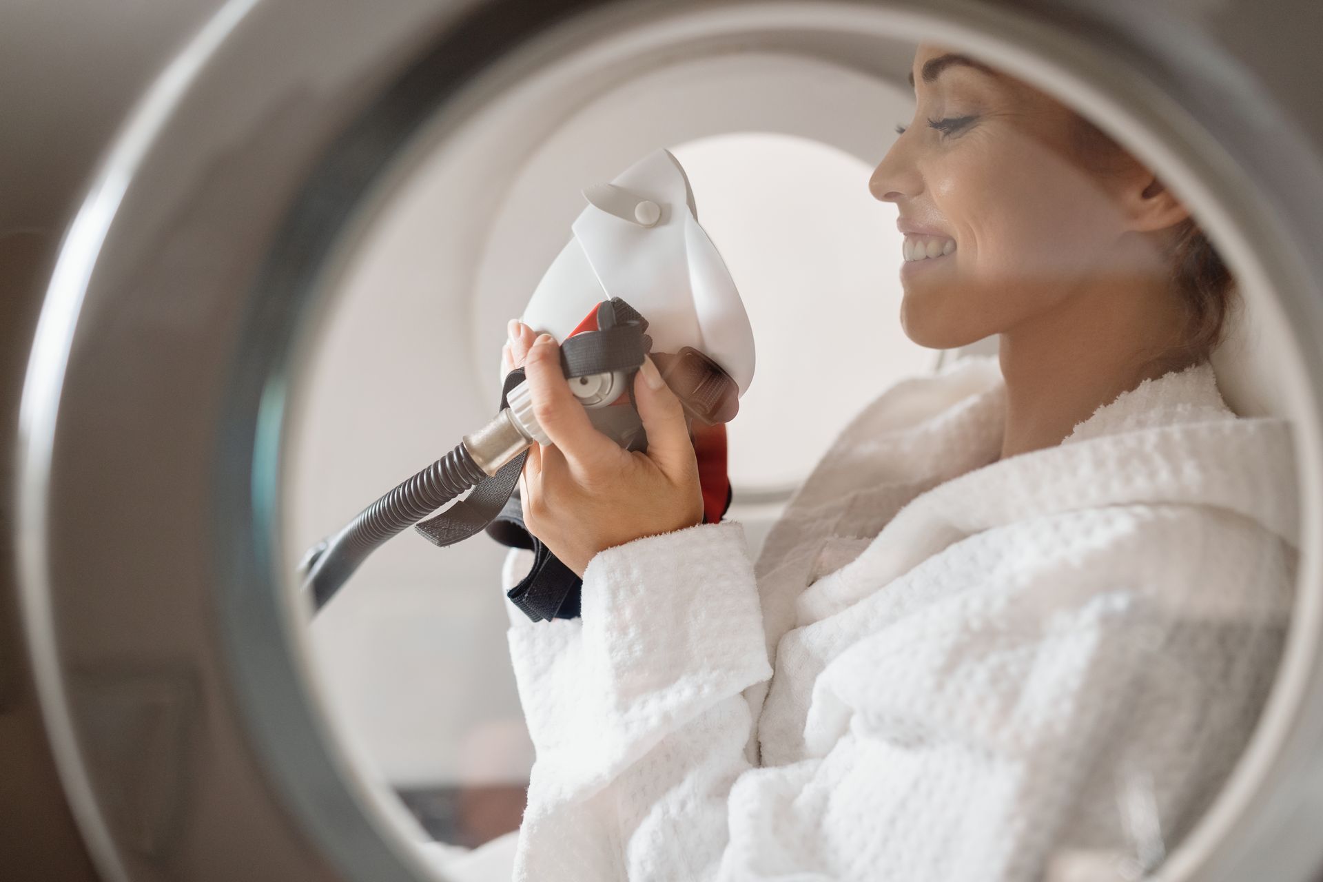 Woman inside the Oxygen Therapy Chamber