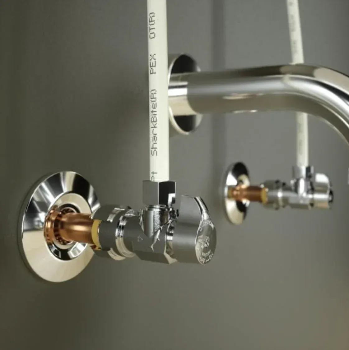 Two angle stops under a sink