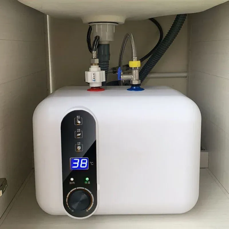 White electric water heater under a sink, with digital display showing 38 degrees Celsius and connected plumbing.