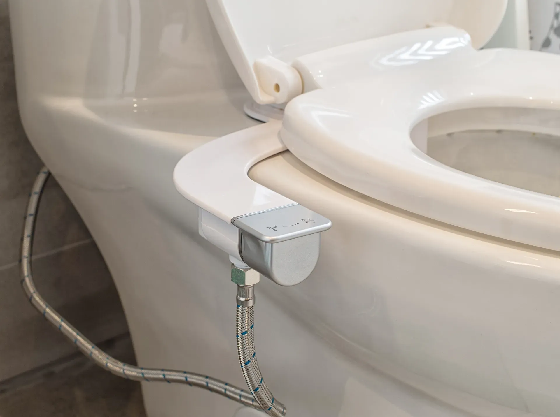 A toilet with an add on bidet