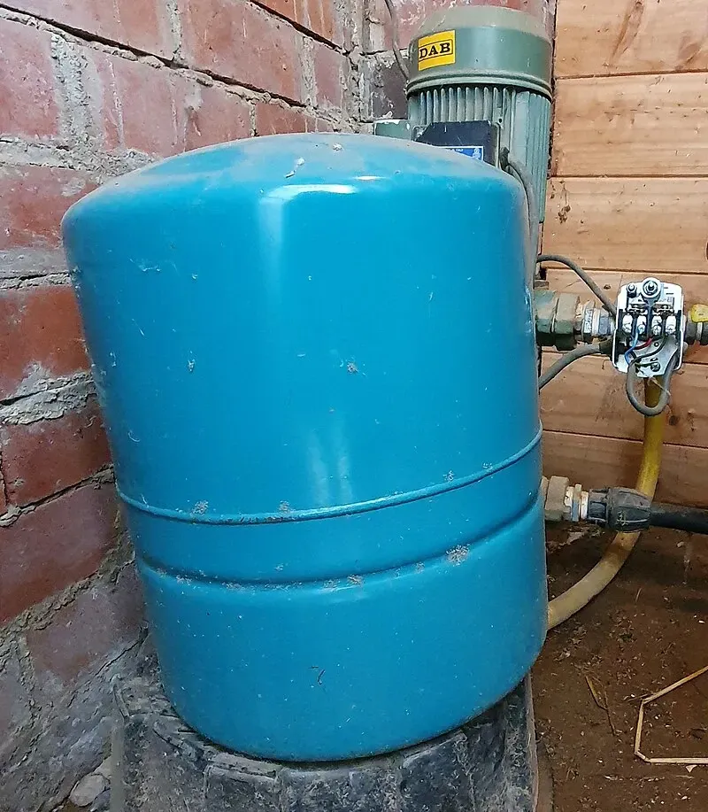 A blue water pressure tank