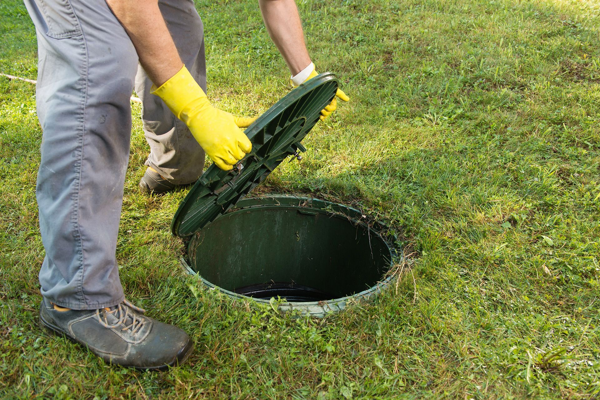 Inspector reviewing underground drain pipe condition