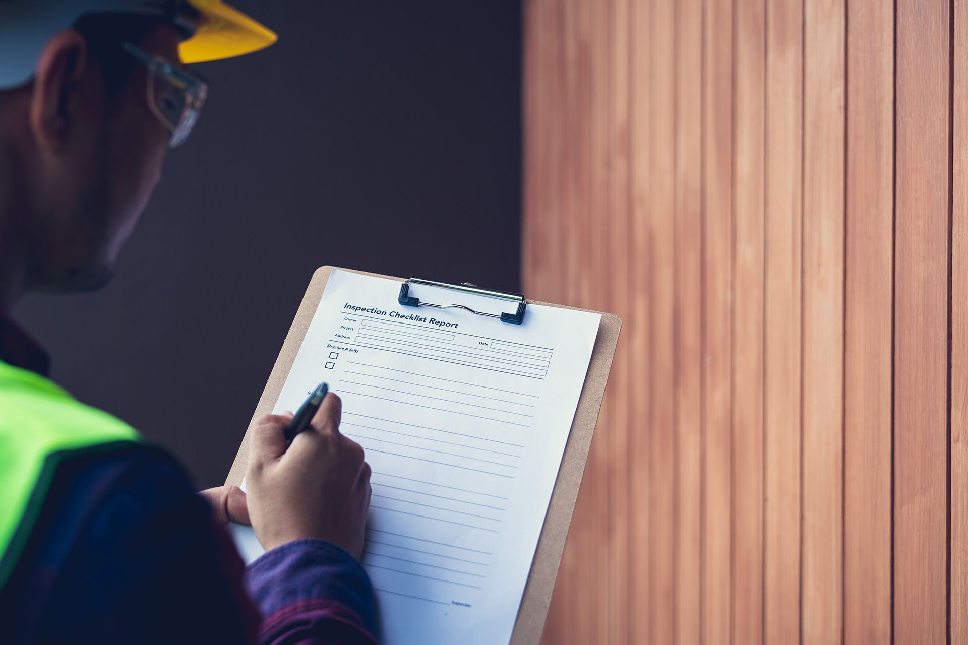 Home inspector reviewing major defects in a house