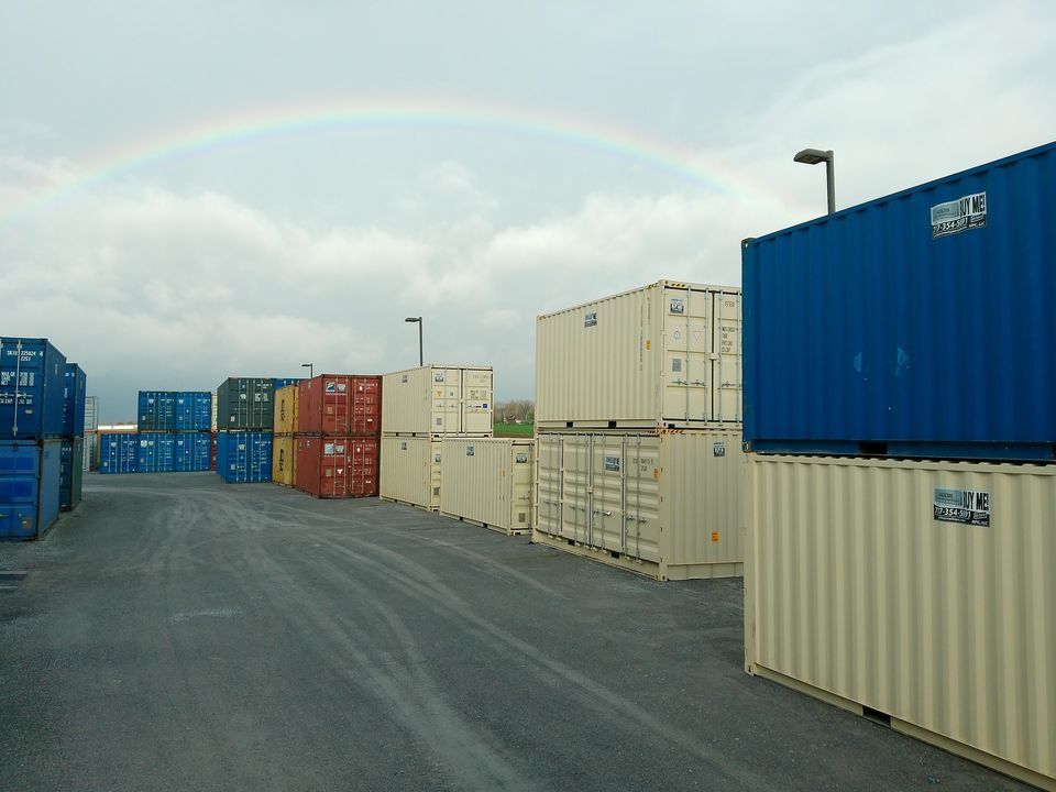 A row of shipping containers with a rainbow in the background — New Holland, PA — Nolts Propane Connections