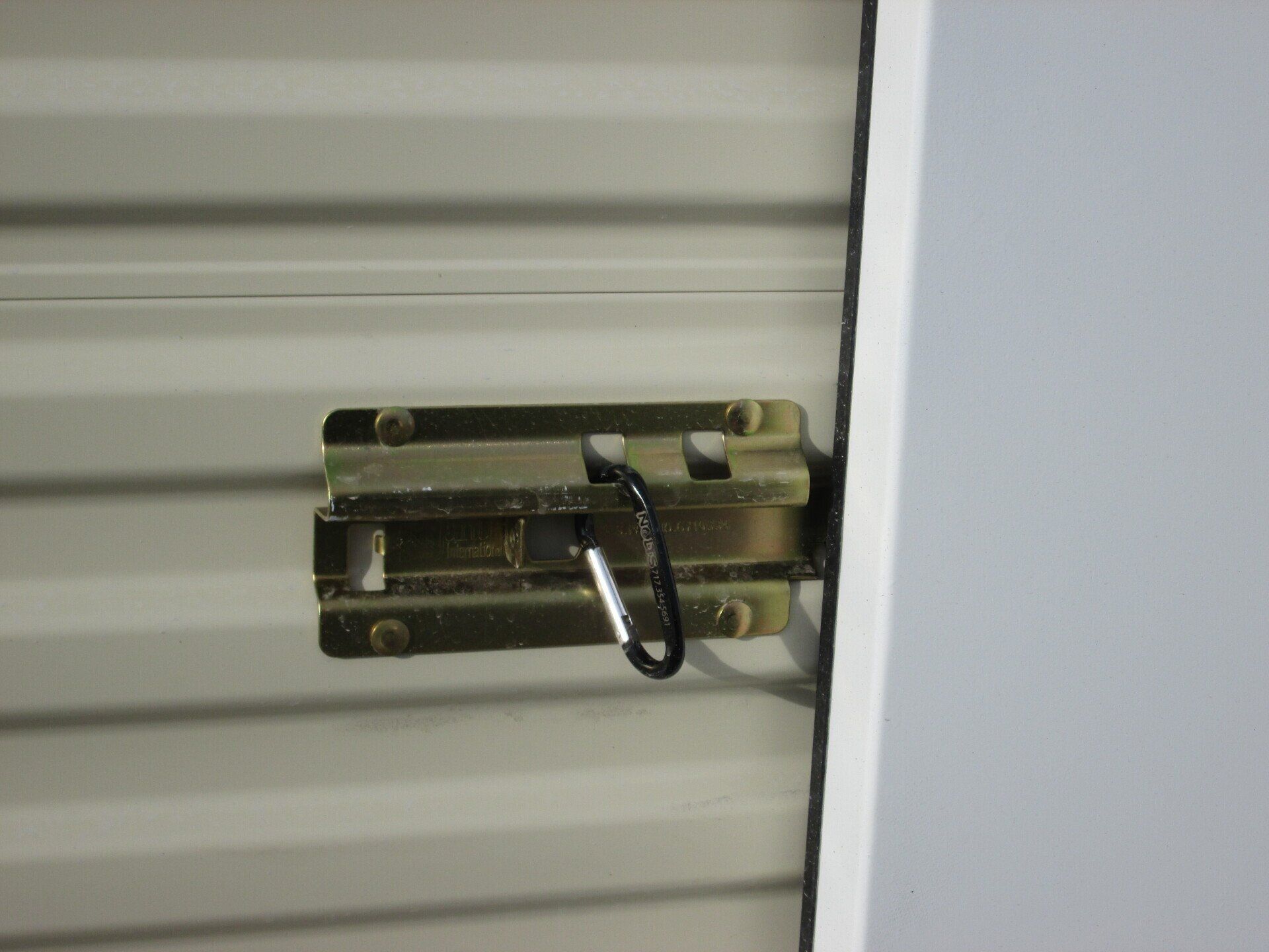 A door latch with a carabiner attached to it — New Holland, PA — Nolts Propane Connections