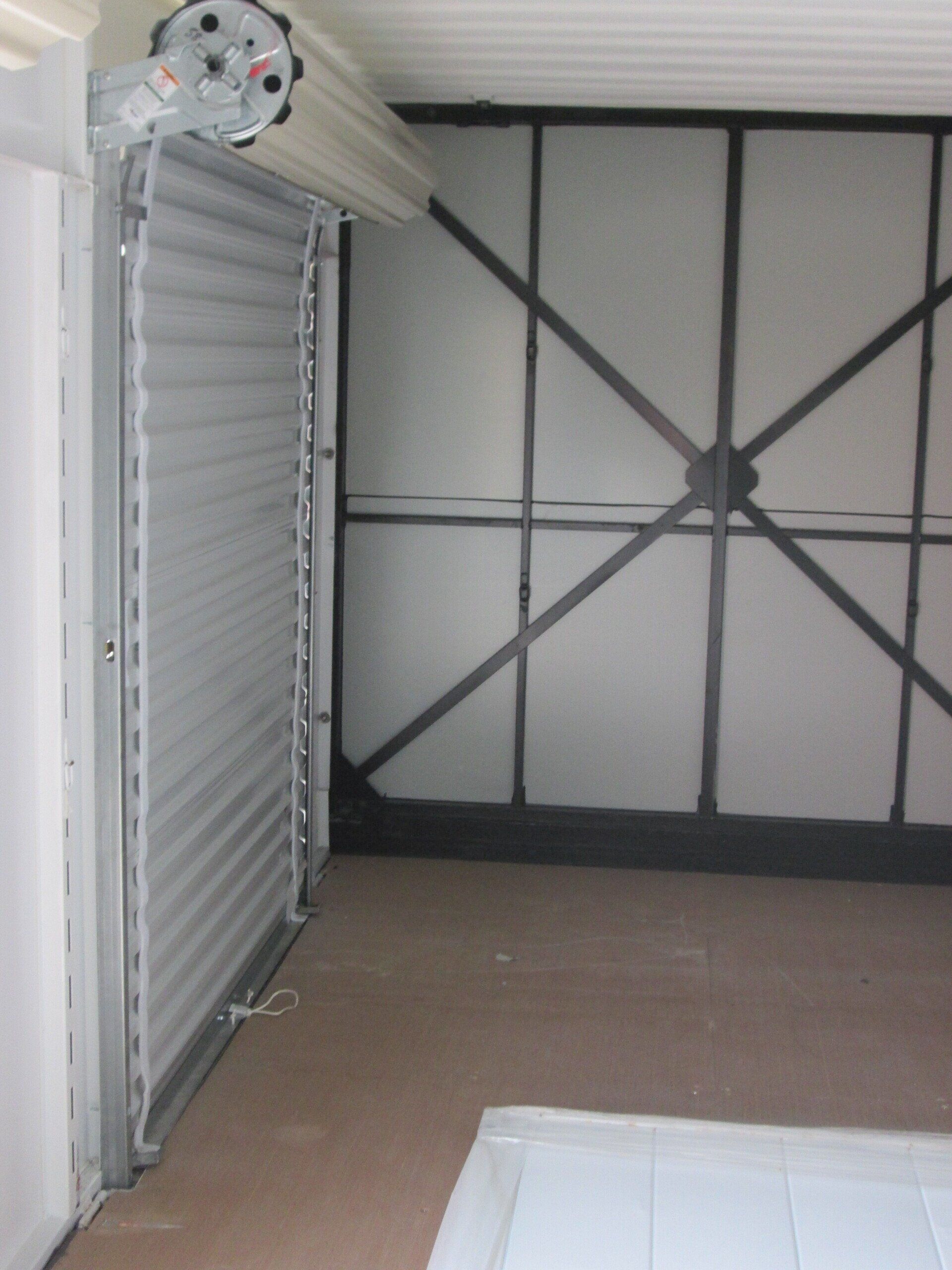 An empty garage with a roller door open — New Holland, PA — Nolts Propane Connections