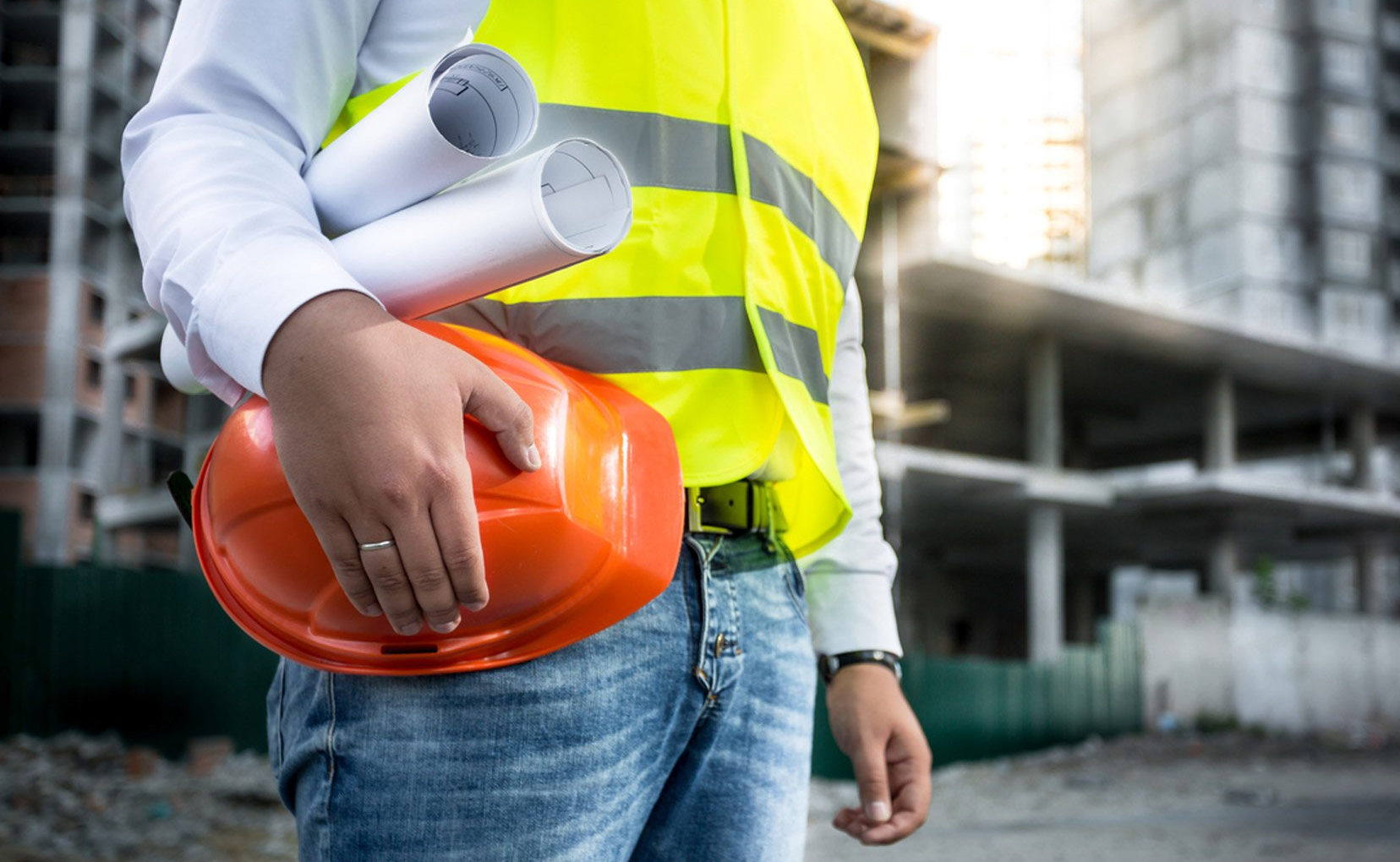 Steel Building Contractor Holding Blueprints