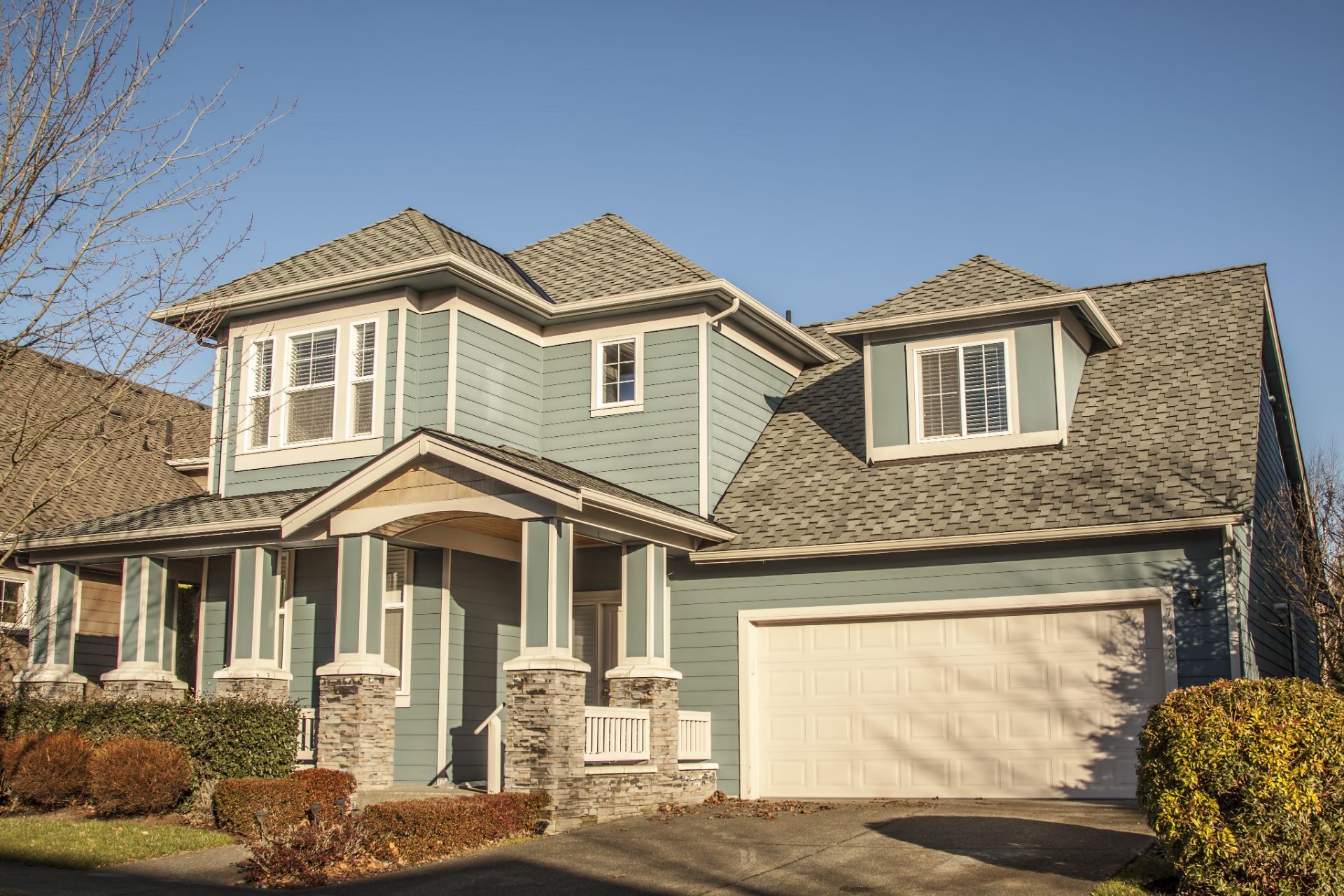 Home with pale green siding
