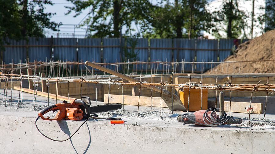 a construction site with a saw and construction equipment