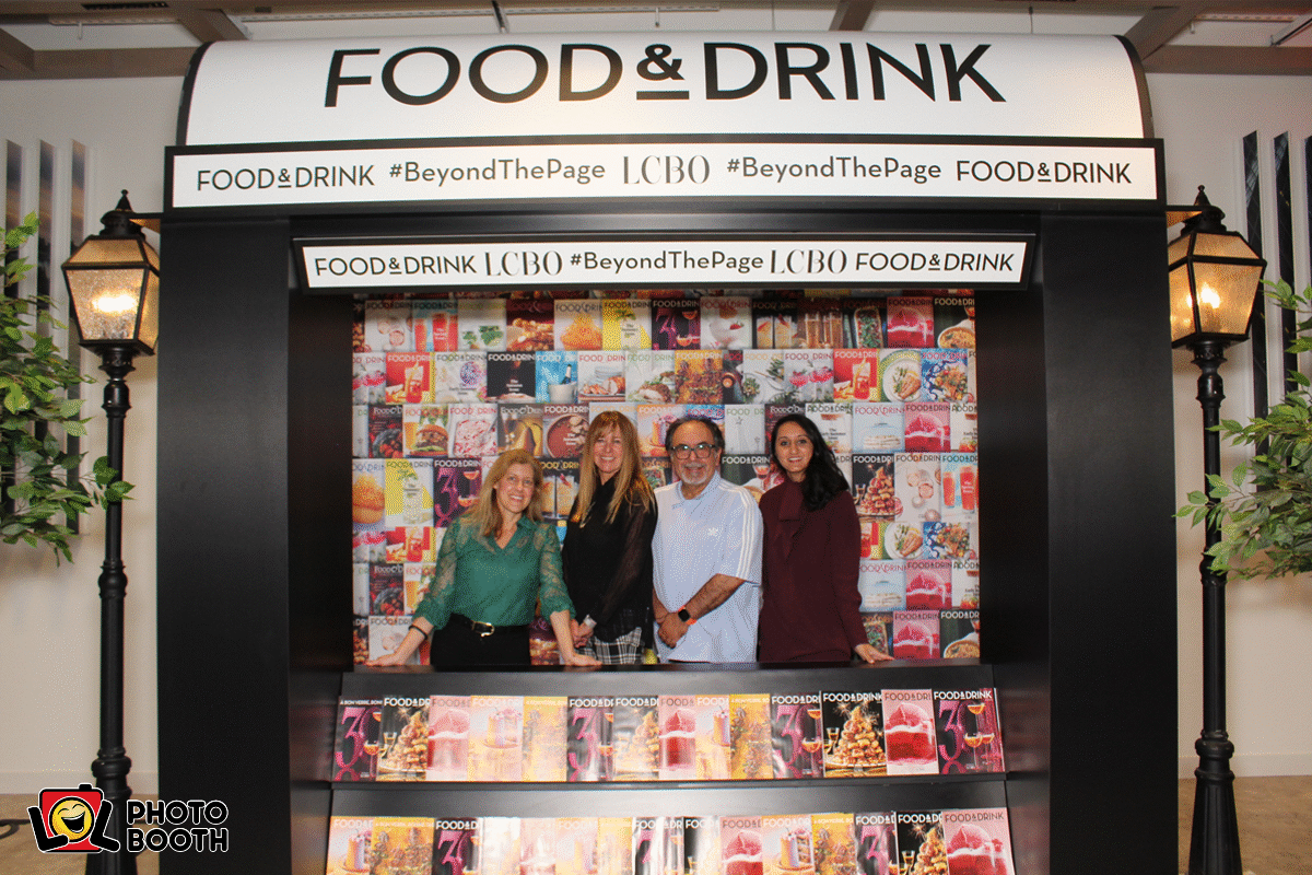 A group of four people posing for a GIF photo booth picture in the LCBO Food & Drink booth.