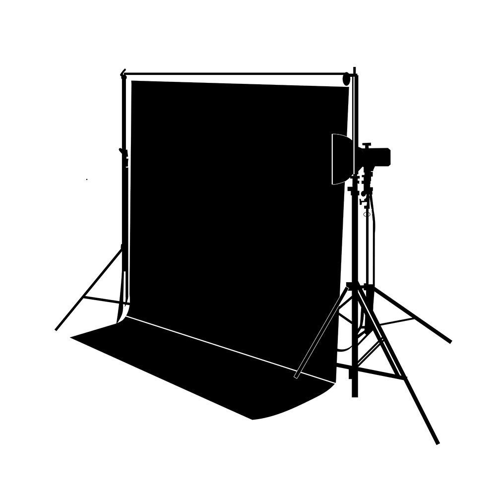Black backdrop set up with a light and stand for photography.