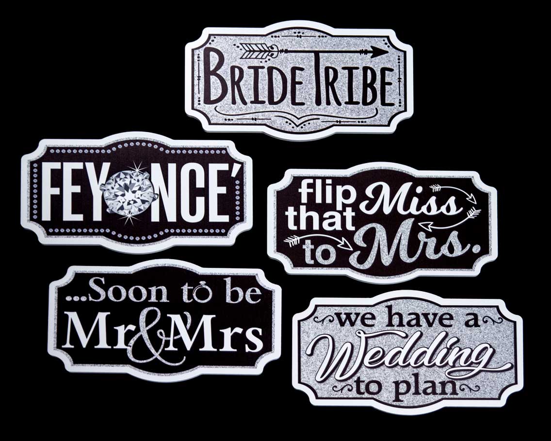 Signs with wedding-themed phrases: 