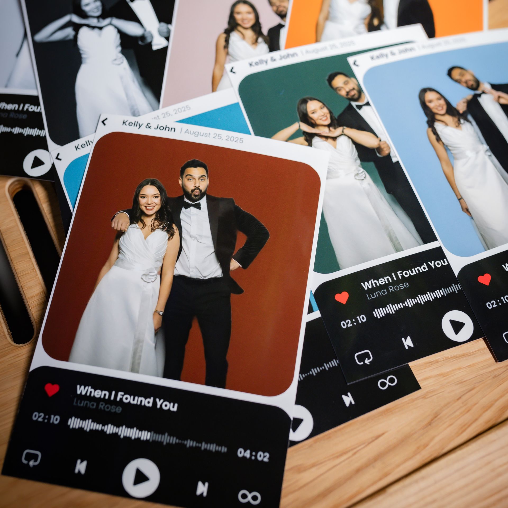 Stack of wedding-themed cards with couple photos, music player design, and text. Various background colors.