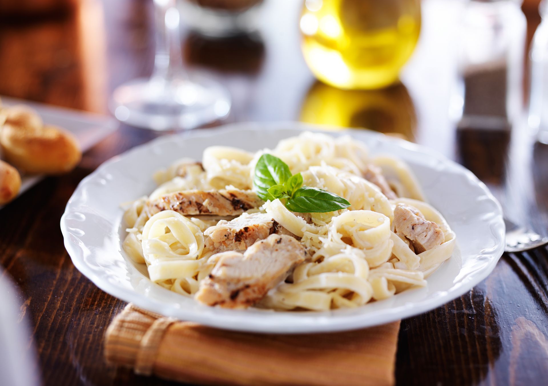 Grilled chicken with fettuccine alfredo, a delicious dish from the Authentic Italian Menu in Garden City, SC. 