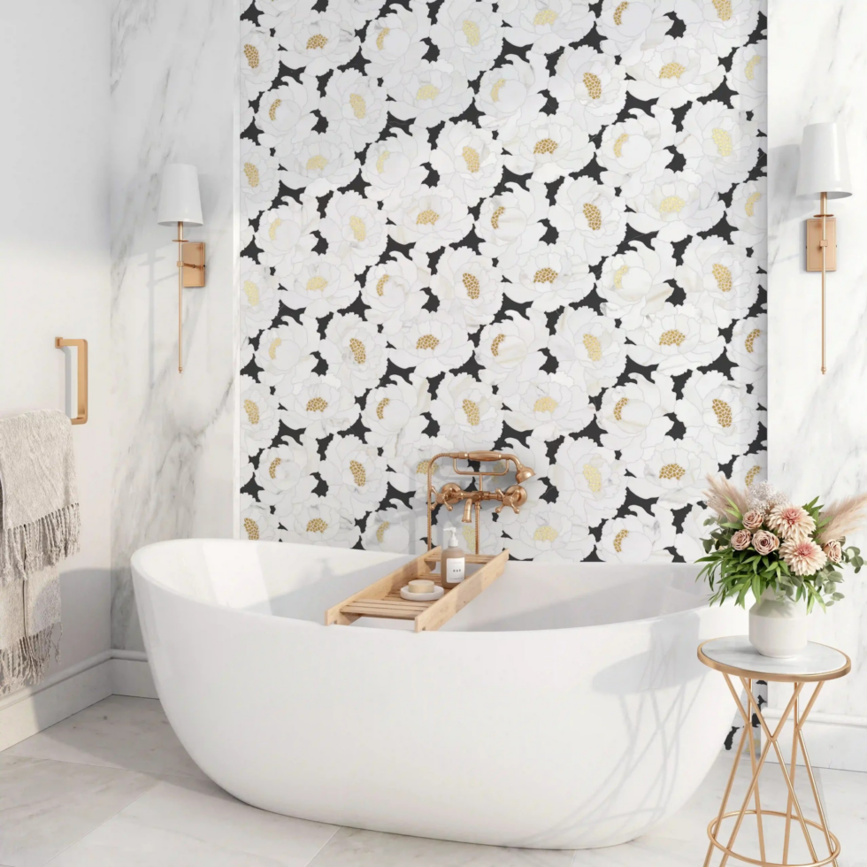 Modern white bathroom with a freestanding tub, floral wallpaper, and gold accents