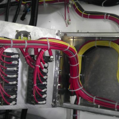 A bunch of wires are connected to a metal box