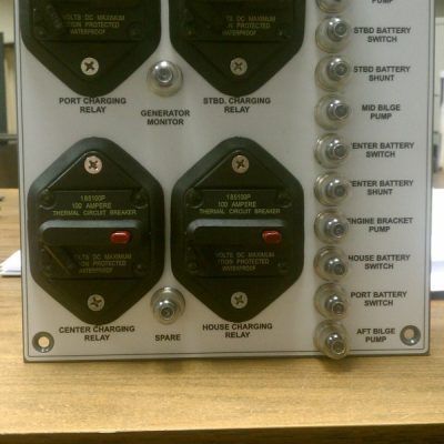 A white board with a bunch of switches on it
