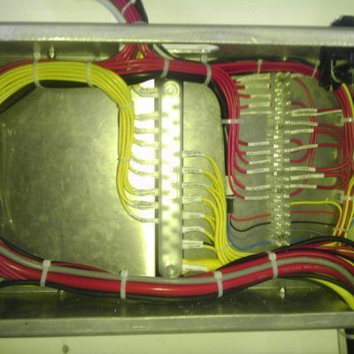 A bunch of wires are connected to a metal box.