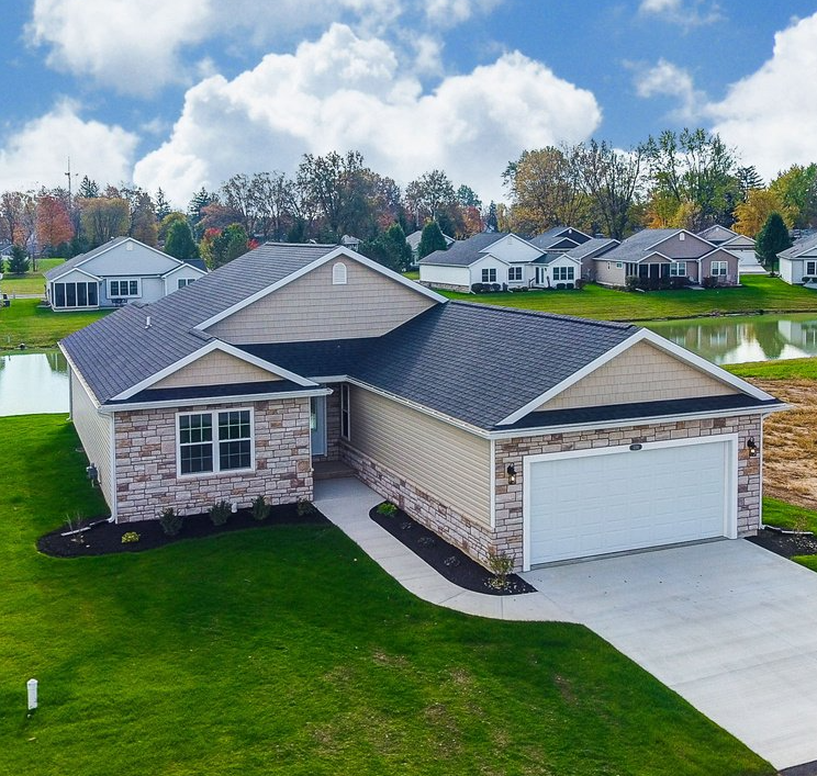 Worker Checking Roof Status – Elida, OH – Lawson Brothers Construction