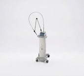 Medical device with a clear tubing loop on a white base against a plain background