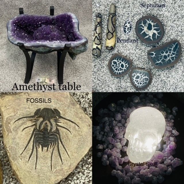 Amethyst crystal table, fossil artwork, polished stone pendants, and a quartz skull on purple crystals