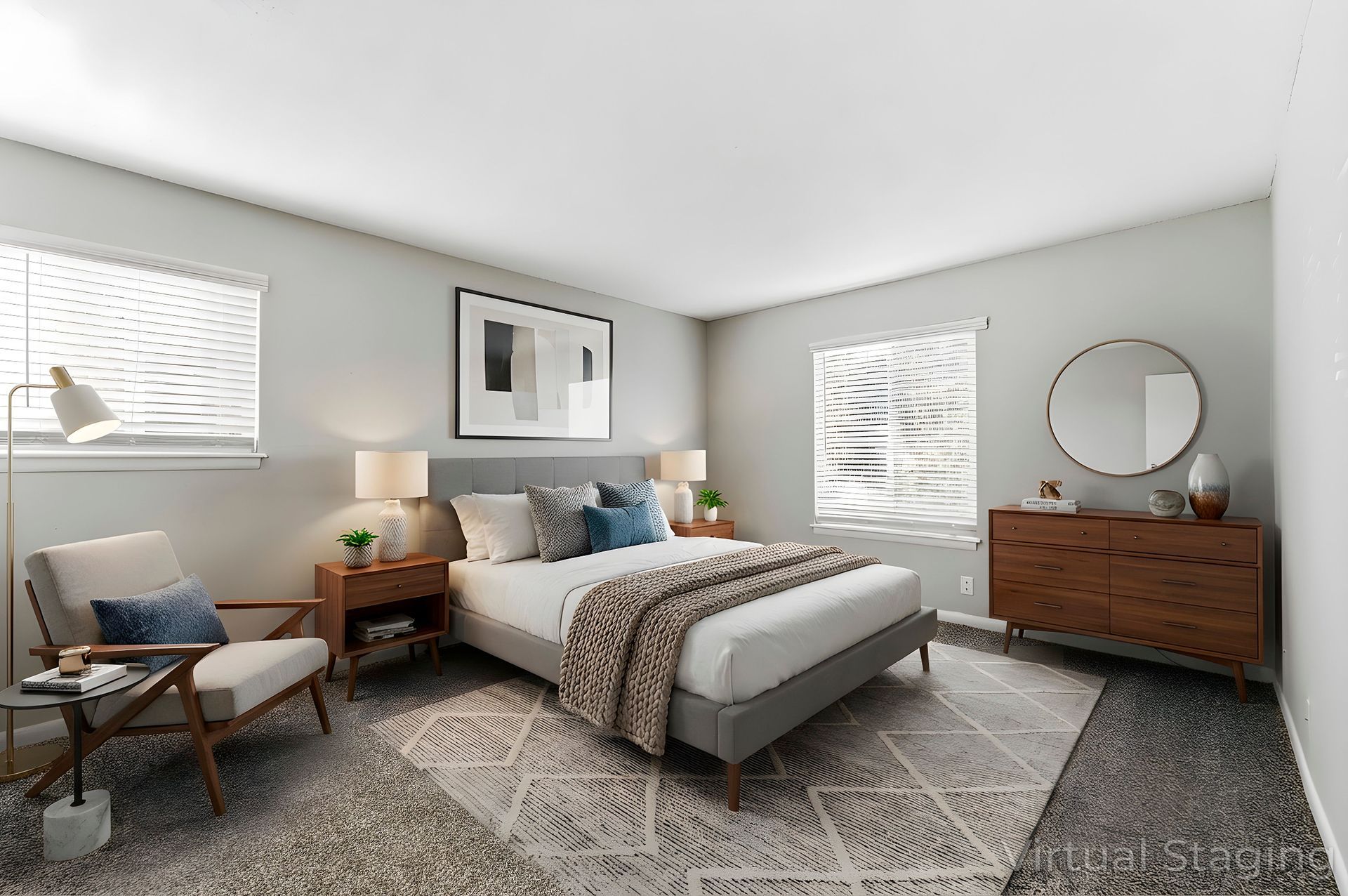 Bright modern bedroom with a bed, nightstands, dresser, chair, and patterned rug.