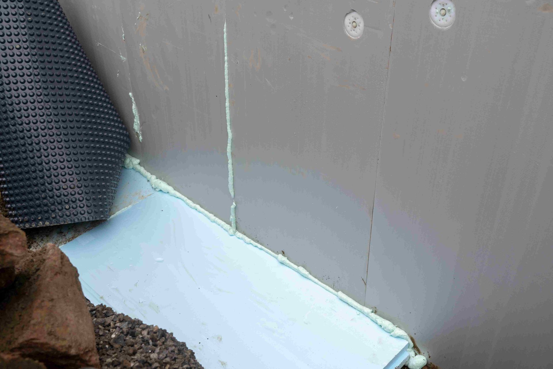 Floor and basement wall caulking solution to keep water from seeping in