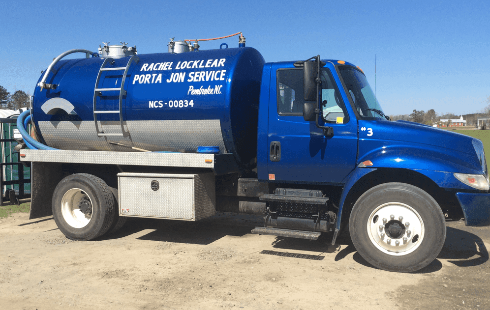 truck with tank for cleaning out portable toilets