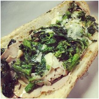 a picture of roast pork and broccoli rabe specialty sandwich