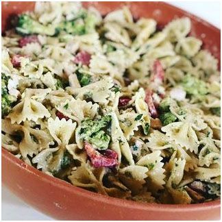 A close up of a pasta salad in a bowl on a table