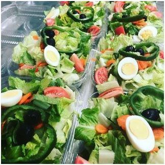 A close up of a pasta salad in a bowl on a table