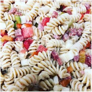 A close up of homemade pasta salad on a plate