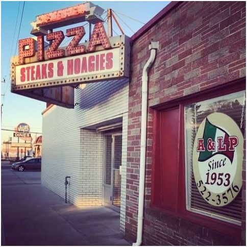 A&LP Foods with a sign that says pizza steaks and hoagies