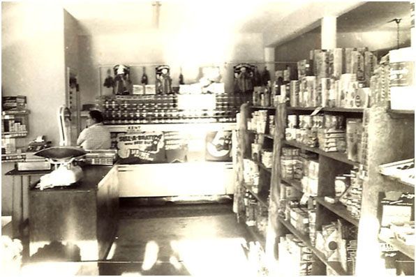 A black and white inside photo of a&lp foods in 1961