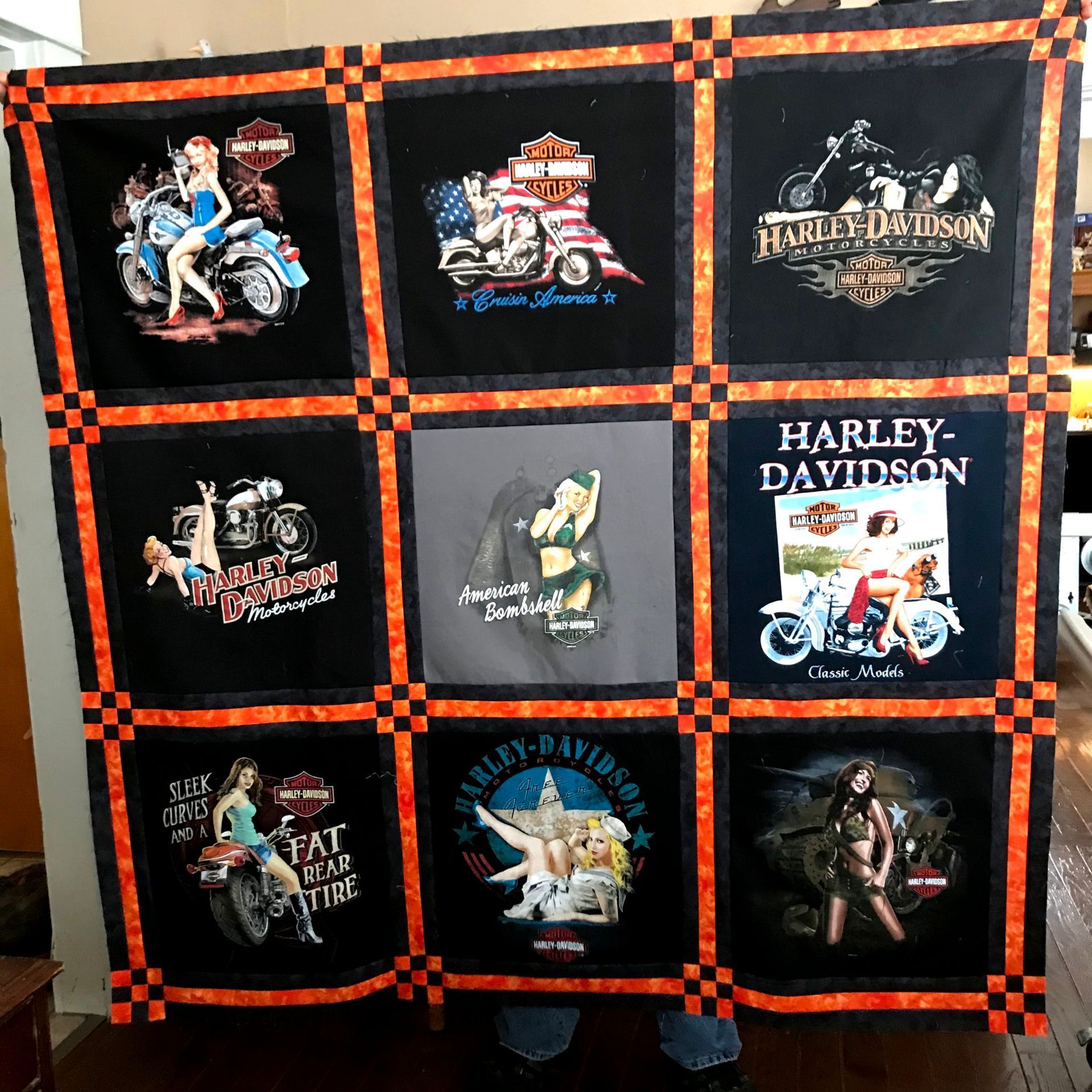 Harley-Davidson themed quilt with nine motorcycle patch panels in black, orange, and white