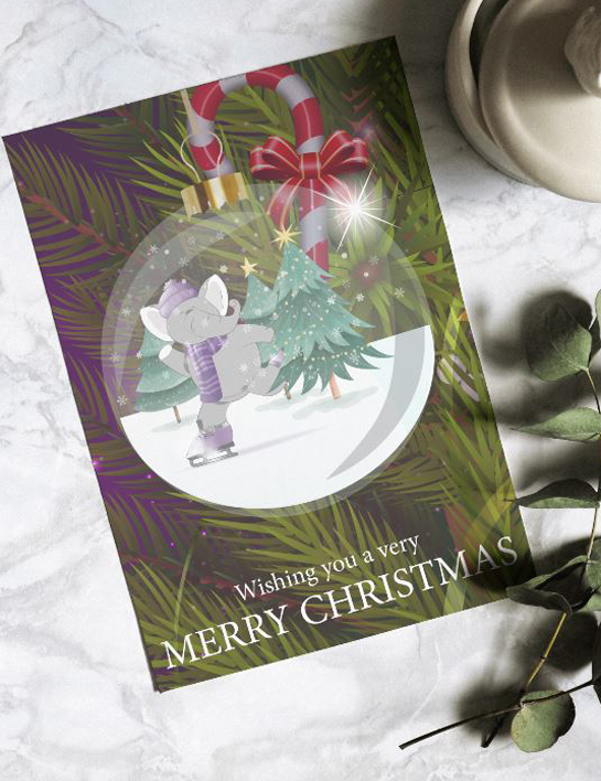 A Christmas card with an elephant in a snow globe ornament, surrounded by pine needles and candy canes.