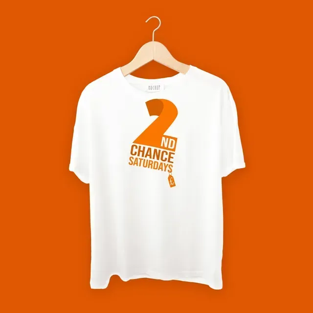 White T-shirt on a hanger against an orange background, featuring the orange text
