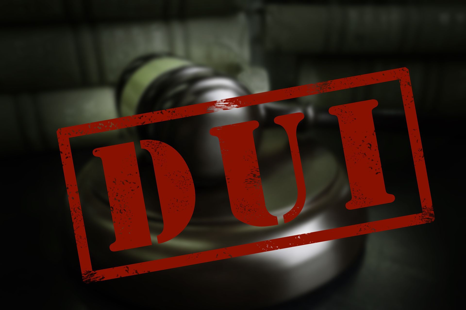 A judgeās gavel blurred in the background with a bold red āDUIā stamp over it.