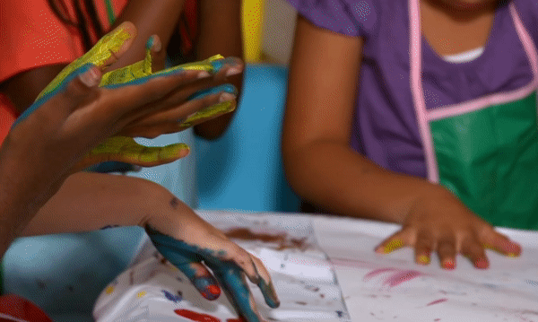 children painting with their hands