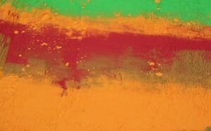 A close up of a colorful painting on a wall.