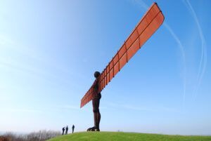 A metal sculpture over tourists