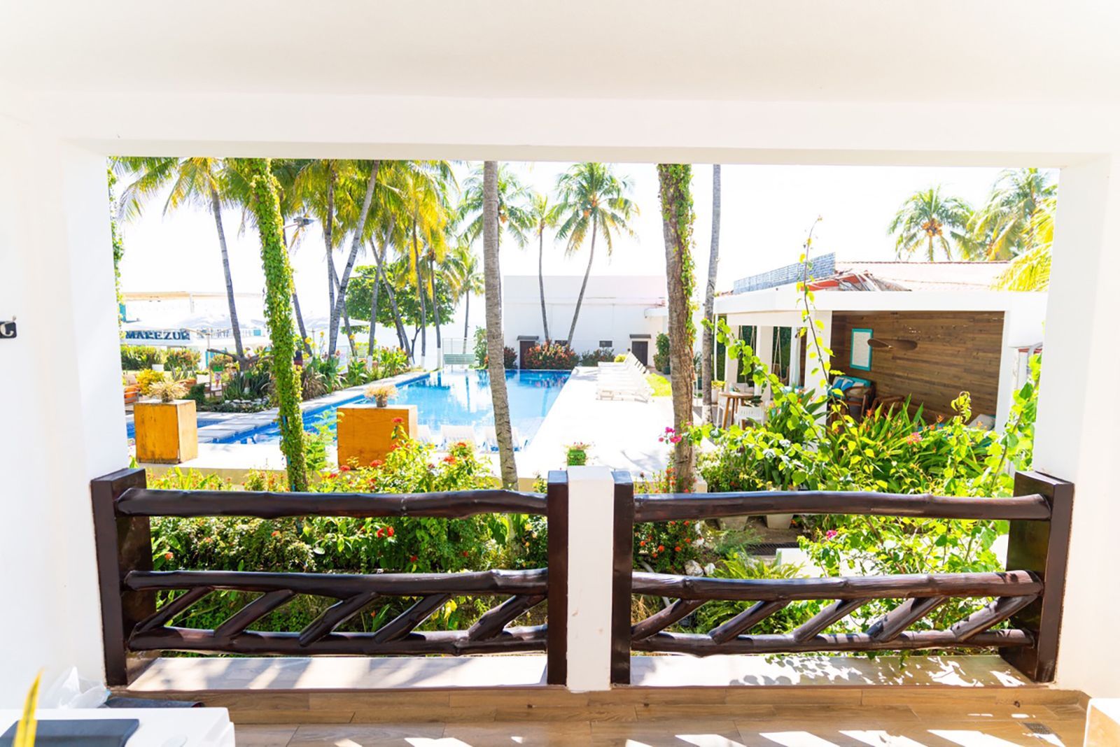 Tropical, palm trees, pool, and ocean view beyond, Los Farallones.