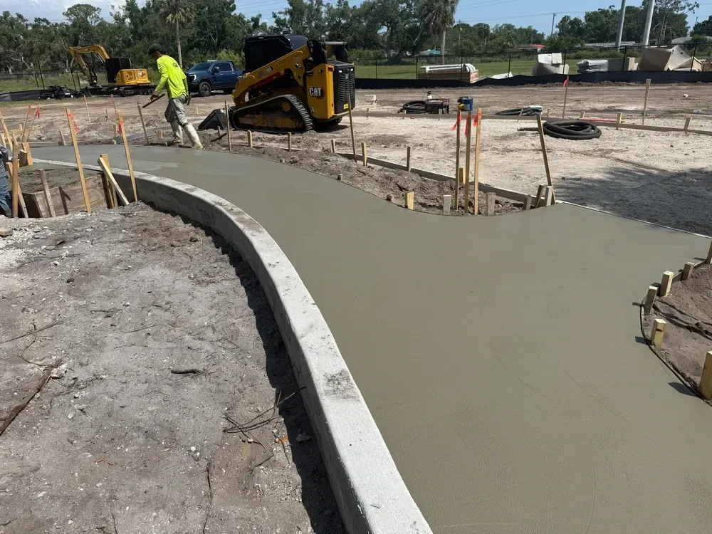 Kensington Park playground site work in Sarasota with graded subgrade and new concrete curbing