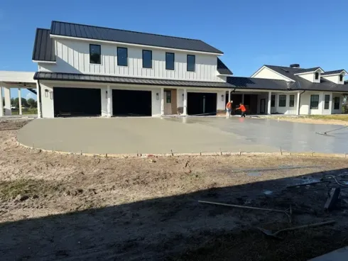 Graded house pad prepared in front of a new two-story home