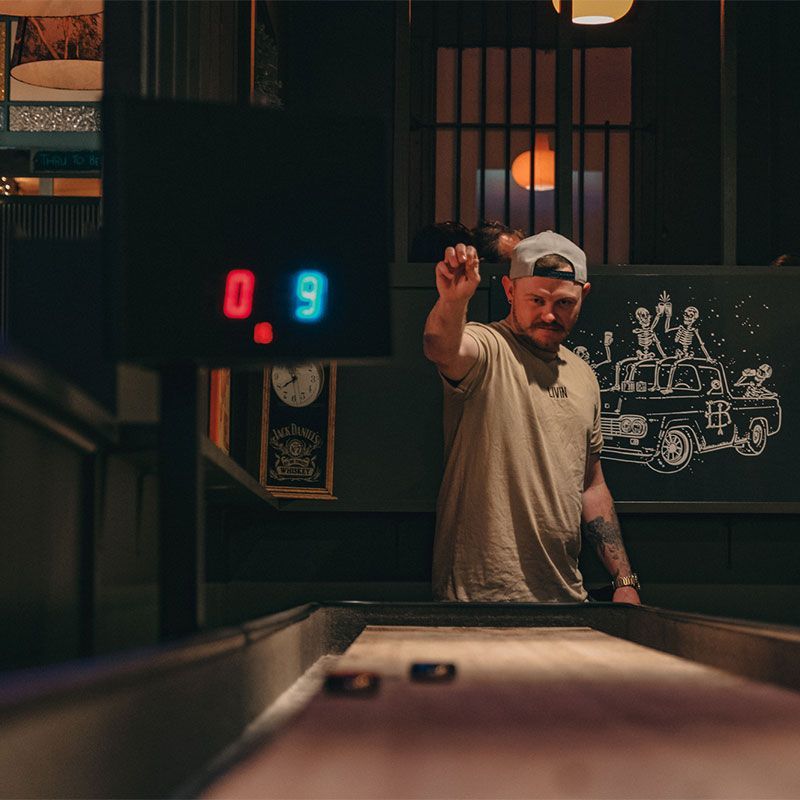 PLAYING SHUFFLEBOARD